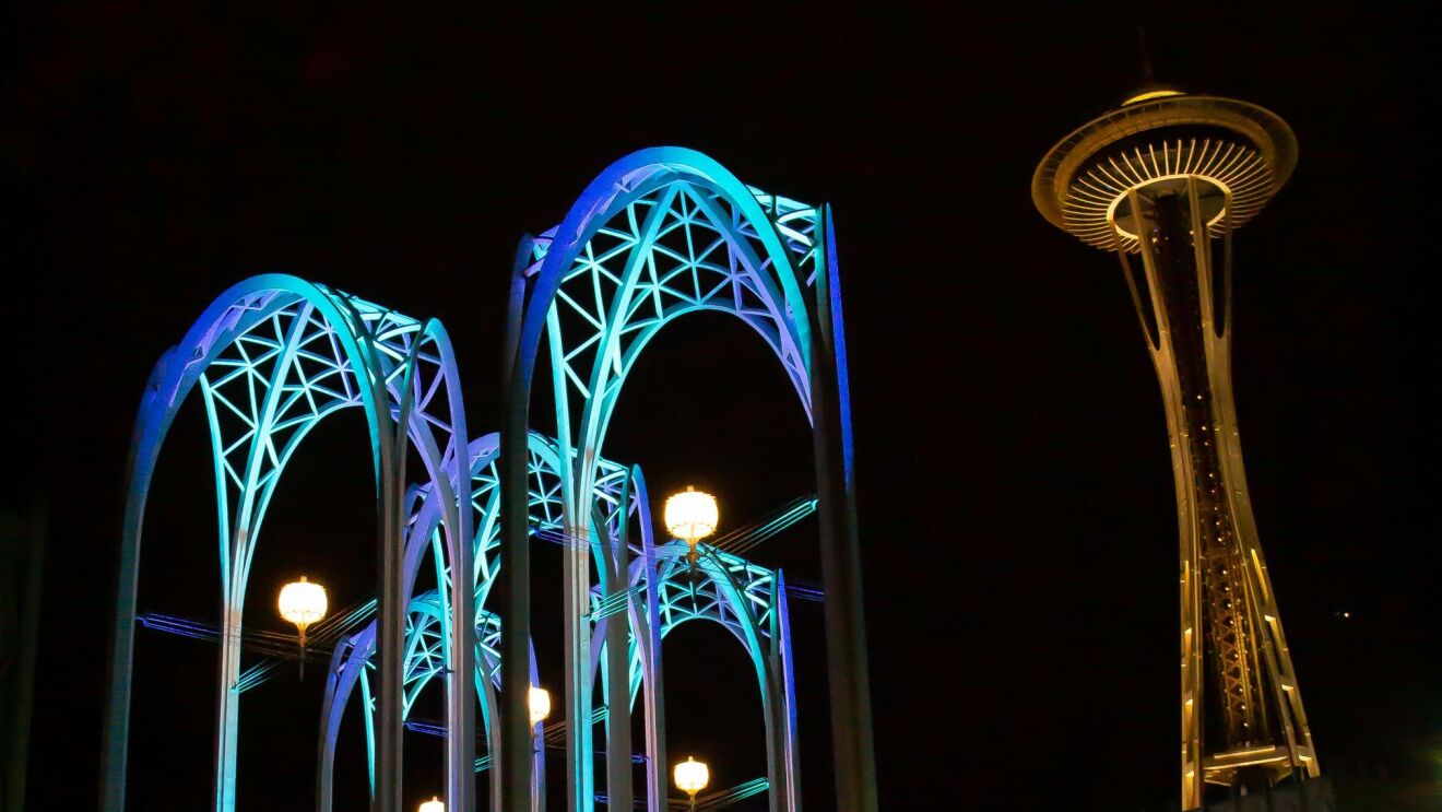 Photos of the Pacific Science Center (PacSci) arches with blue lights at night
