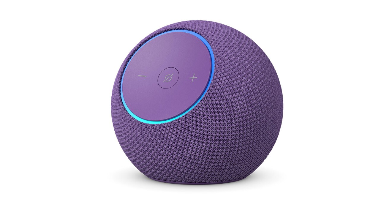 白背景に、紫色の球形のデバイス。前面の丸いパネルに「-」「+」ボタンと、中央に斜線入りの丸アイコン。パネルの外周部分が青く点灯している。パネル以外の本体表面はメッシュ状。