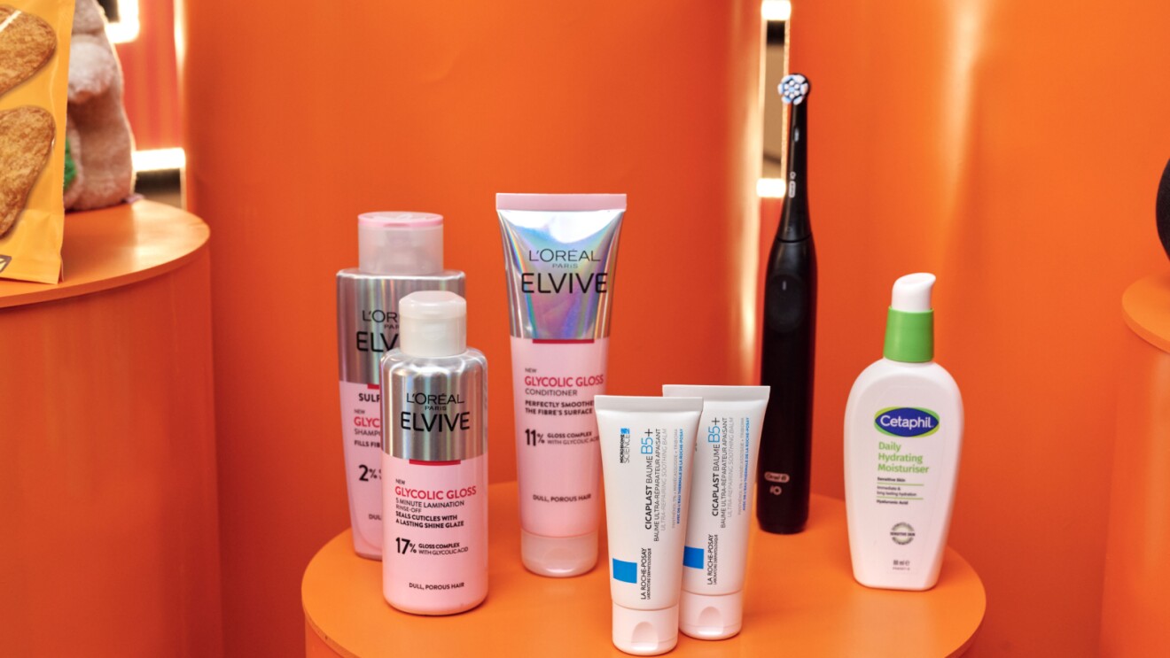 Black Friday products on an orange table - including producs from L'Oreal, Oral , Cetaphil and La Roche Posay