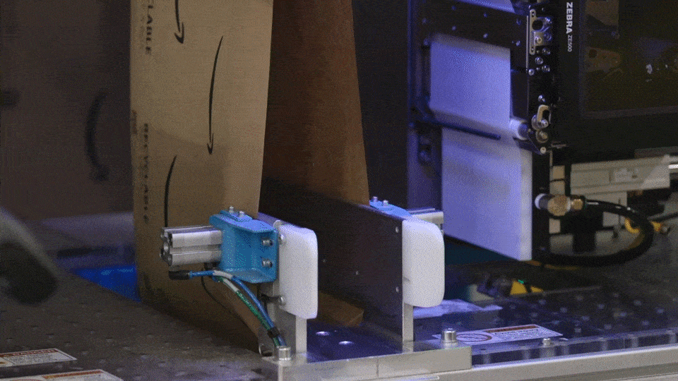A GIF of Amazon's robotic system, Packaging Automation, that helps reduce packaging waste.