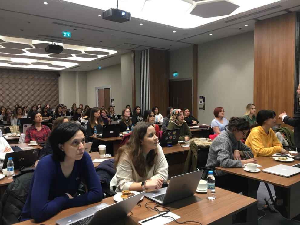 Turkish women carefully listening to the presentations