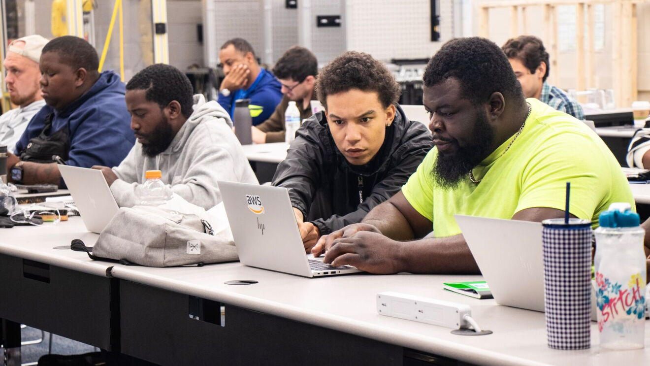 AWS training in Columbus OH: individuals in training on laptops