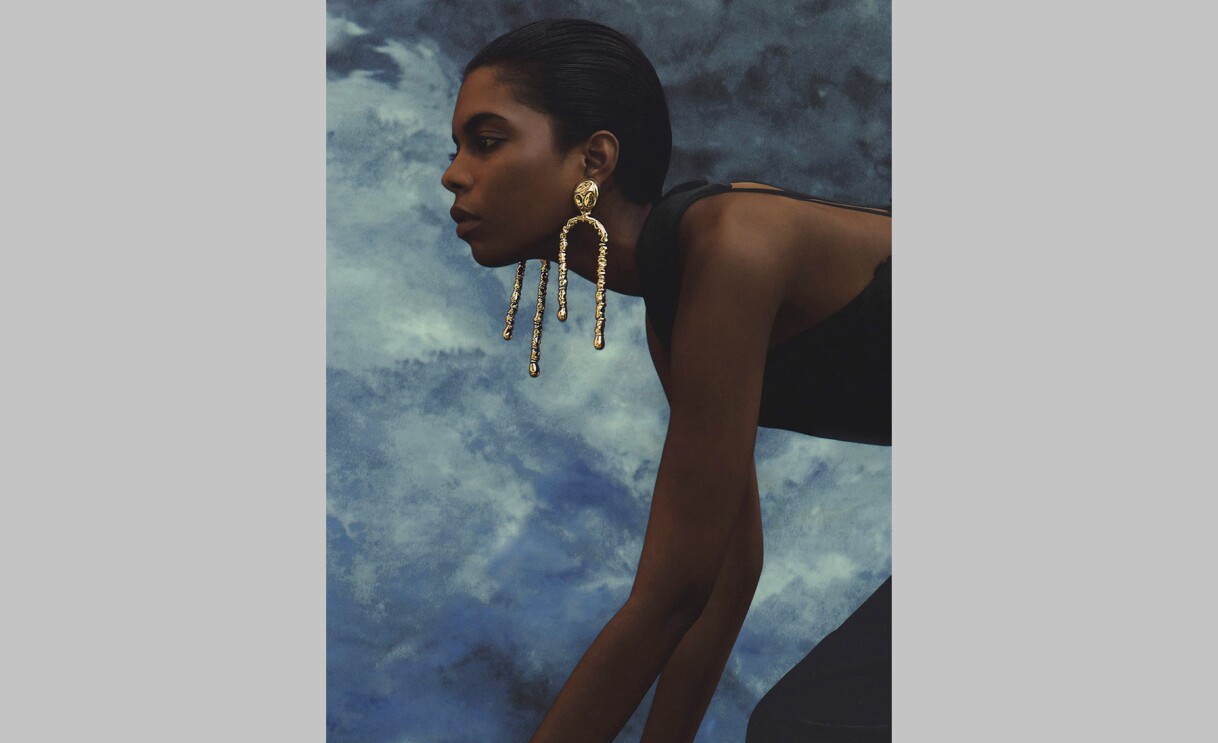 An image of a model wearing earrings by sordo.