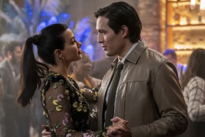 Emeraude Toubia and Desmond Chiam are pictured here dancing in a bar while talking. They star as Lily Diaz and Nick Zhao in the new Prime Video show 'With Love.'