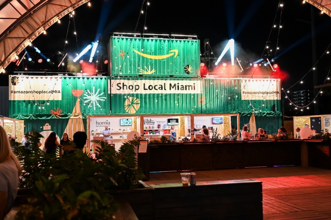 Sellers sit at their booths at the holiday Shop Local Miami event.