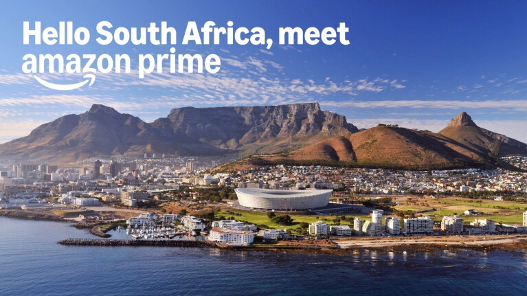 Cape Town cityscape with Table Mountain, stadium, and Amazon Prime welcome message