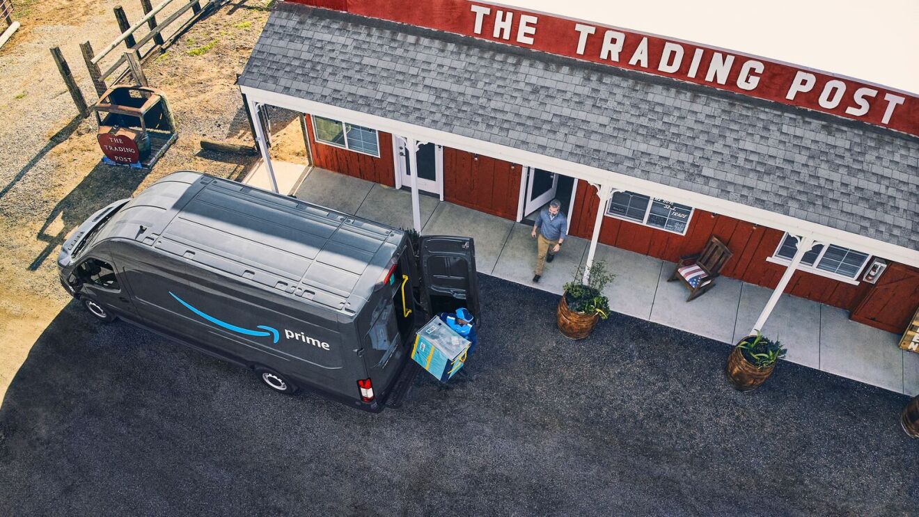 Amazon Prime delivery van parked in front of rural Trading Post store