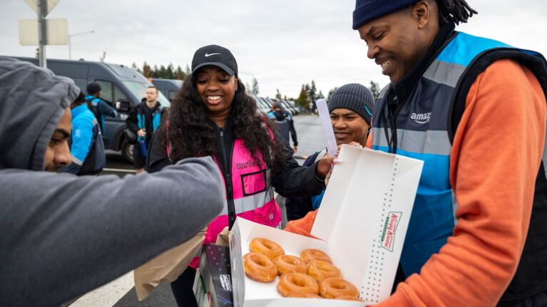 Amazon Delivery Service Partners sharing donuts outside