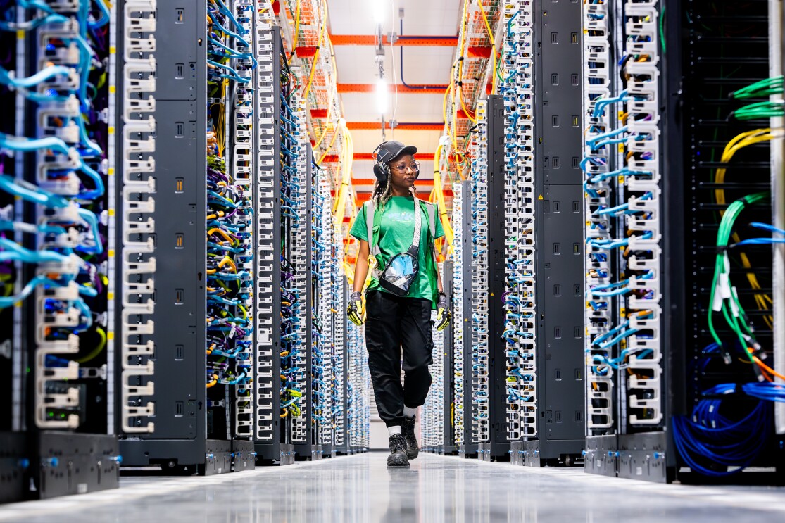 Woman walking through data centre