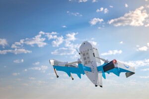 Amazon Prime Air drone flying in blue sky with scattered clouds