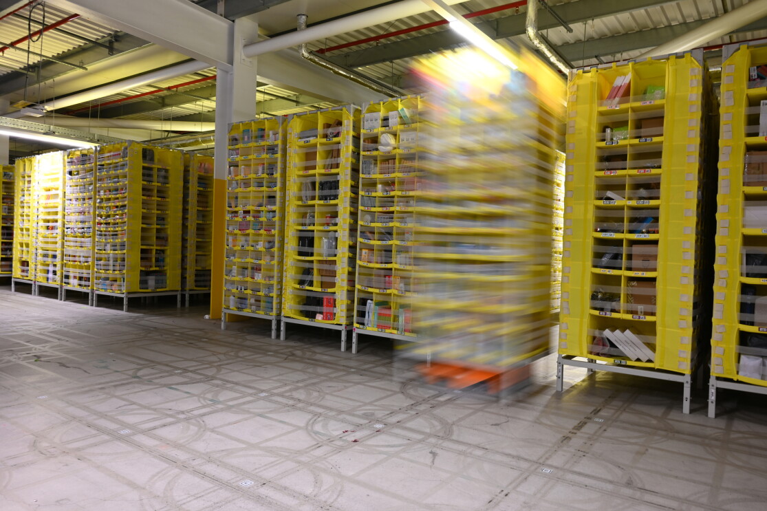Robots moving around the floor holding pods of products 
