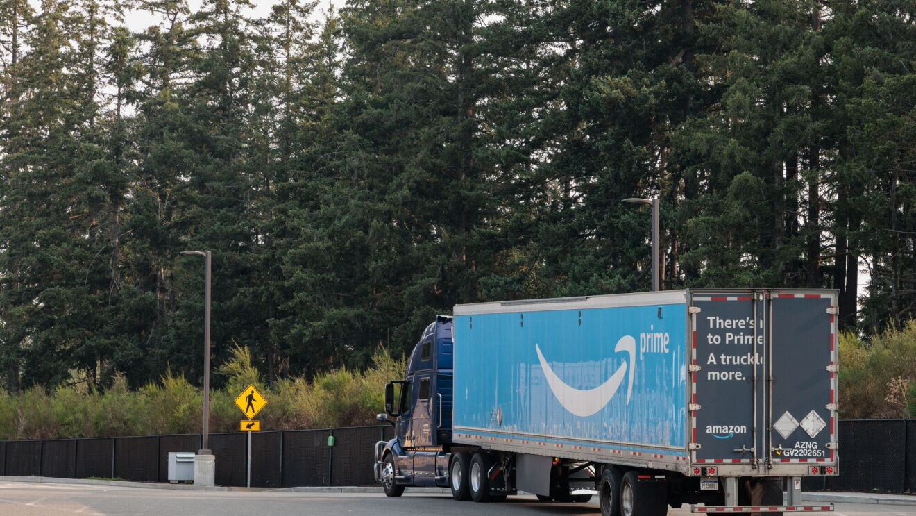 An Amazon delivery truck in a parking lot