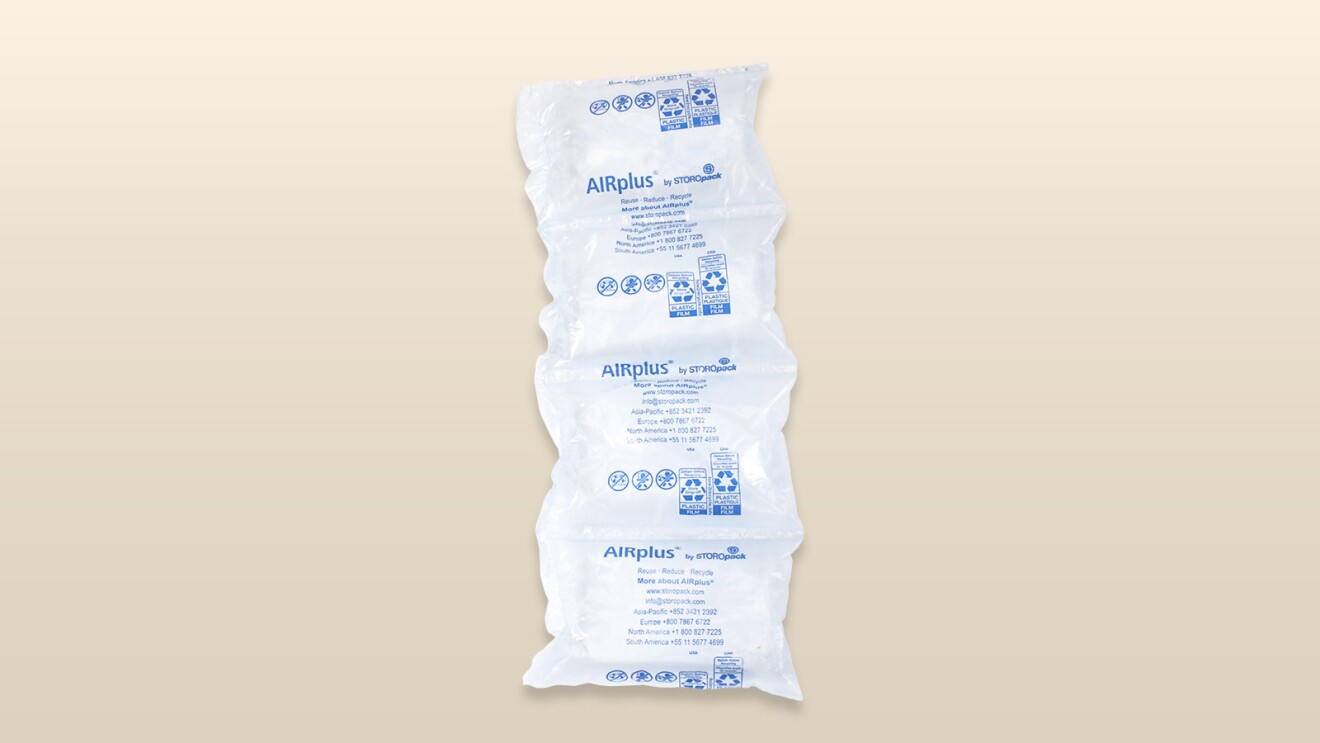 An image of an amazon package with a beige background.