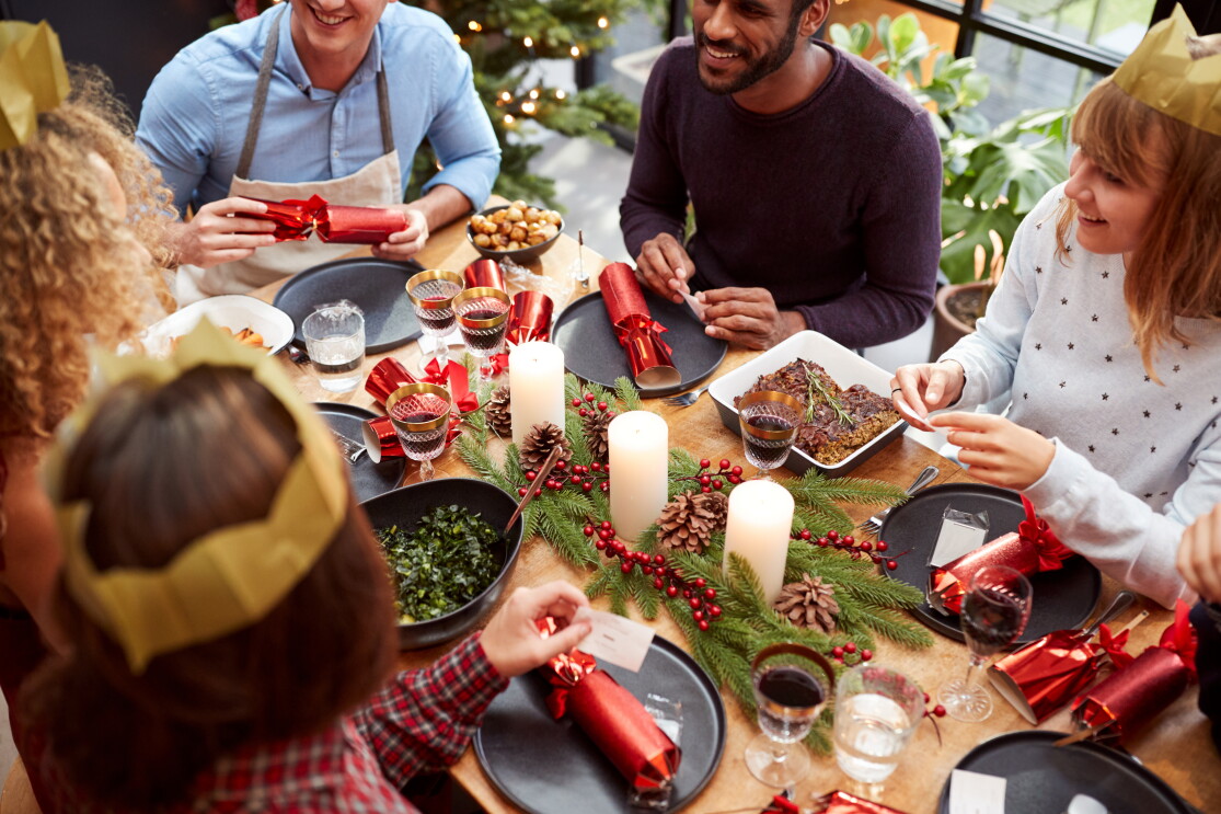 Christmas Lunch with friends reading jokes from crackers