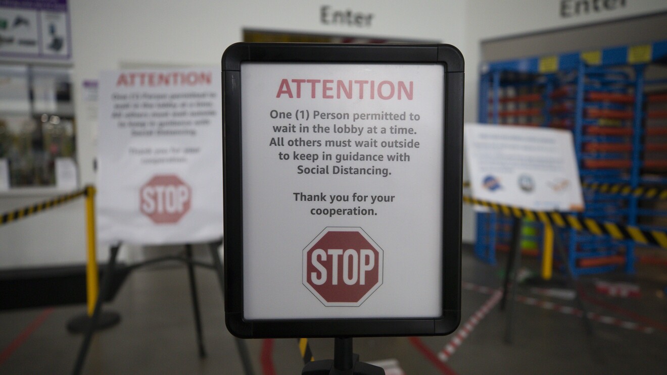 A sign at an Amazon fulfillment center noting social distance requirement
