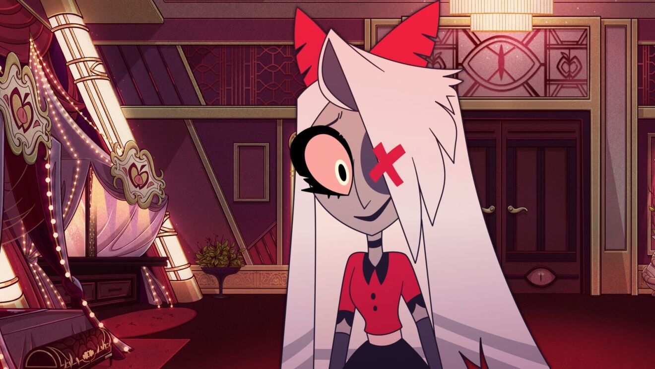Hazbin Hotel: Animated character with white hair and red ears in a luxurious red interior