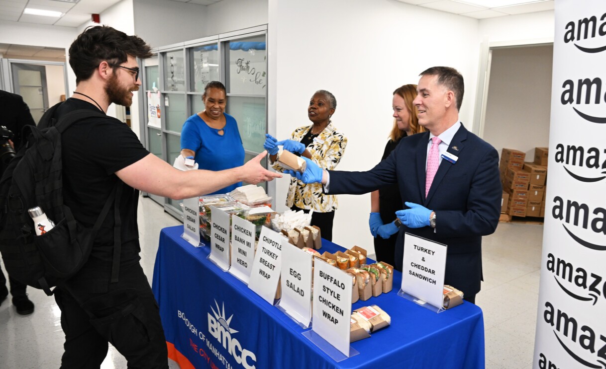 An image of people standing at a booth