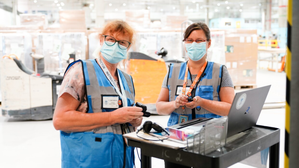 Amazon employees in an FC center