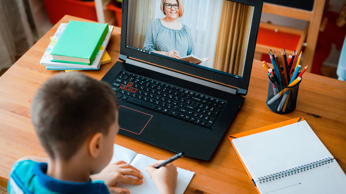 An image of children working on schoolwork in virtual school.