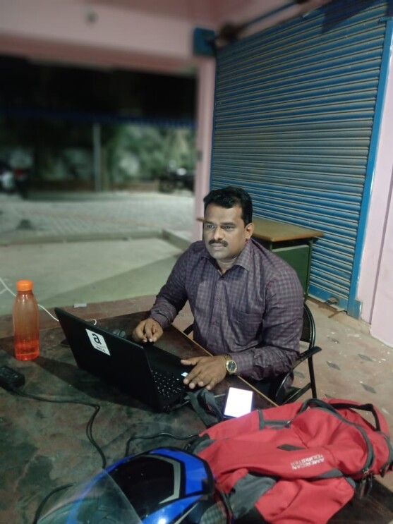 A service partner working on his laptop