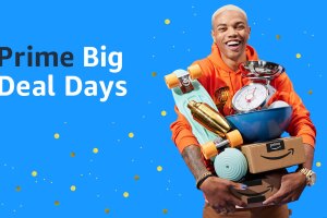 An image of a man holding a lot of items and an amazon box in his hands. There is text beside him that says "Prime Big Deal Days."