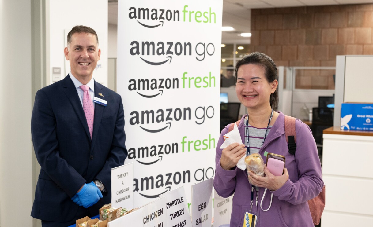 An image of people standing at a booth