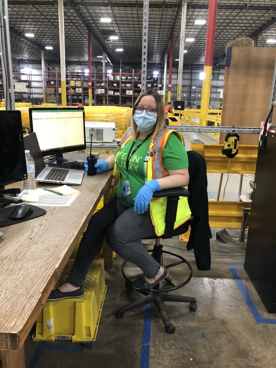 Anazon associate wearing a mask while working