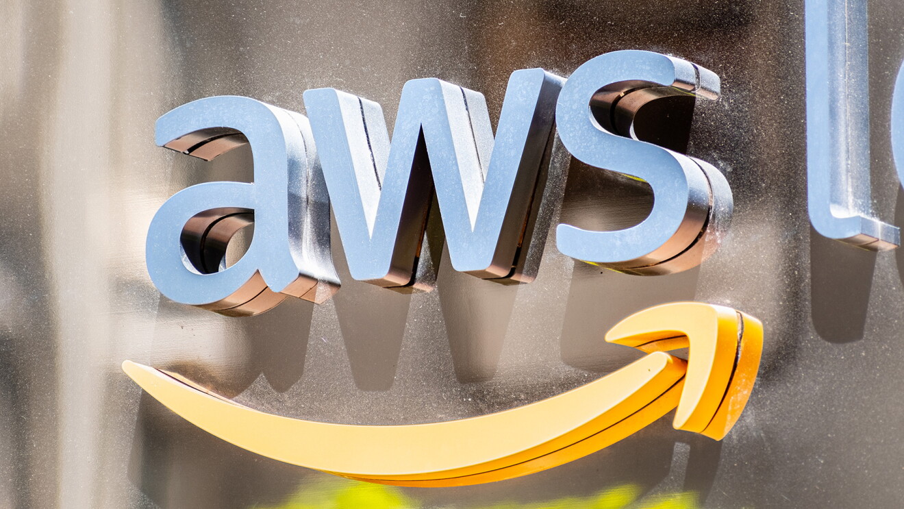 AWS logo in metallic finish on a metallic wall