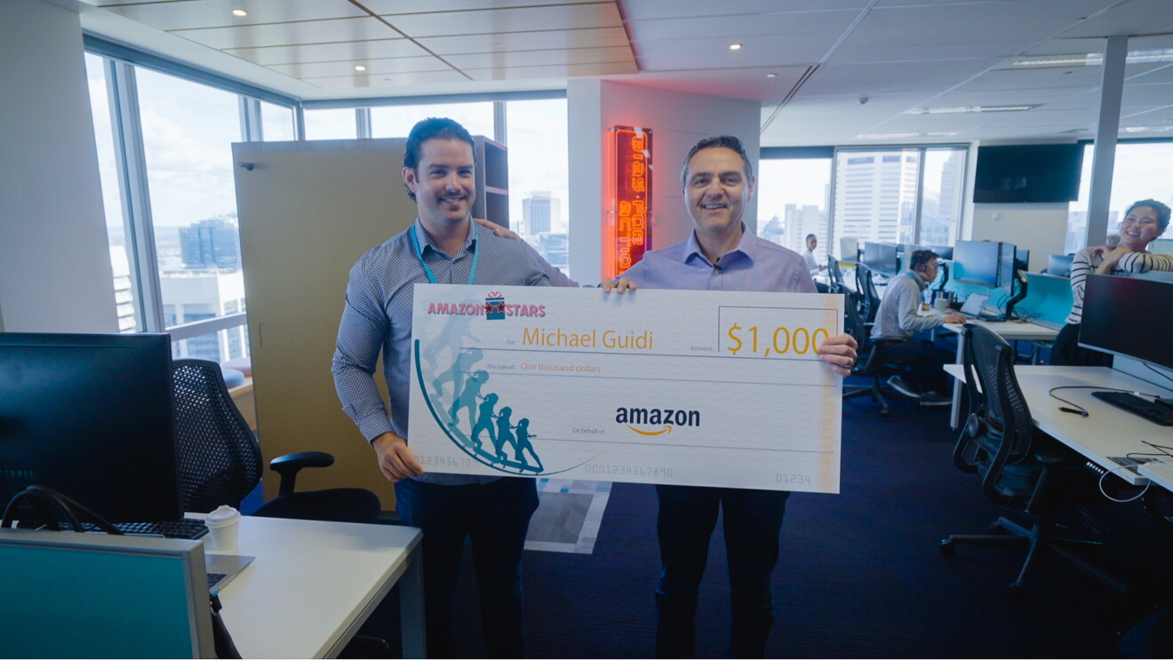 Amazon Stars Michael receiving a cheque