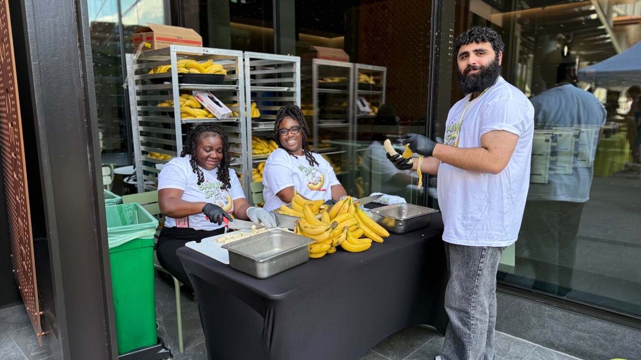 Banana Split Day in HQ2: Volunteers preparing bananas at outdoor food distribution event