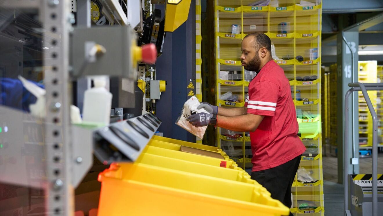 Image of an employee working in an Amazon fulfillment center.