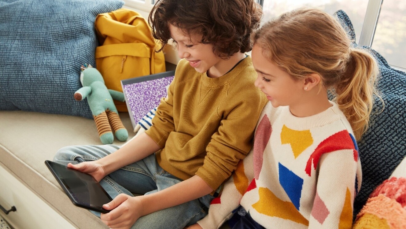 two children use an amazon device