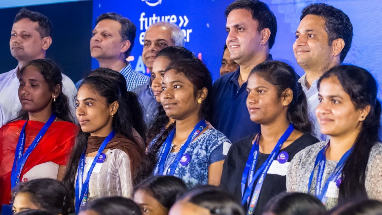 Amazon leaders pose with a bunch of AFE interns.