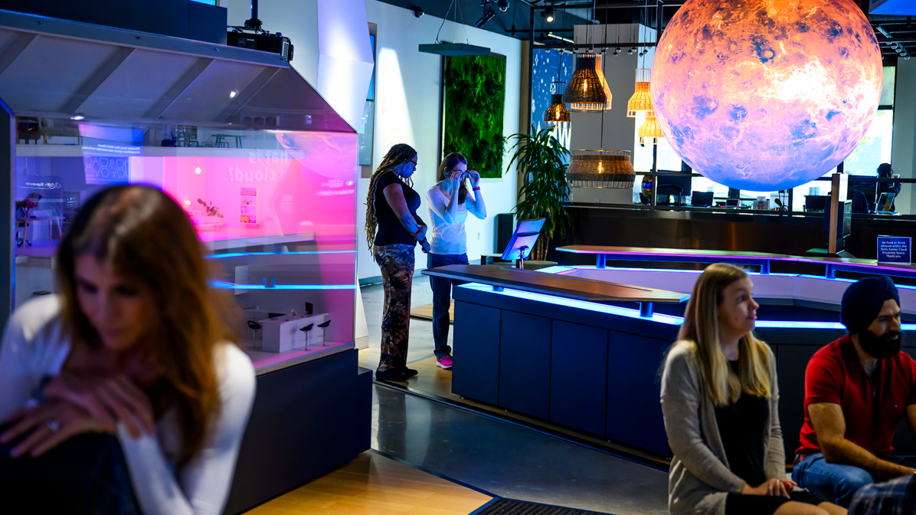 Learners building cloud computing skills and exploring career opportunities at an AWS Skills Center. 