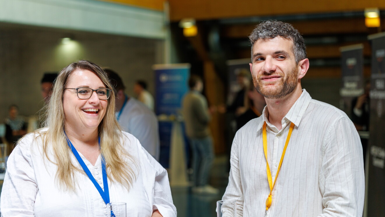 People talking to each other at a business event. 