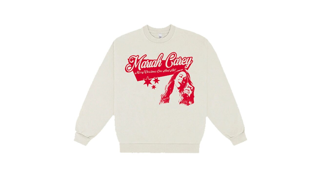 A white pullover sweater with red text that reads "Mariah Carey." Below the text is an illustrated image of Mariah also in red, along with three small stars.