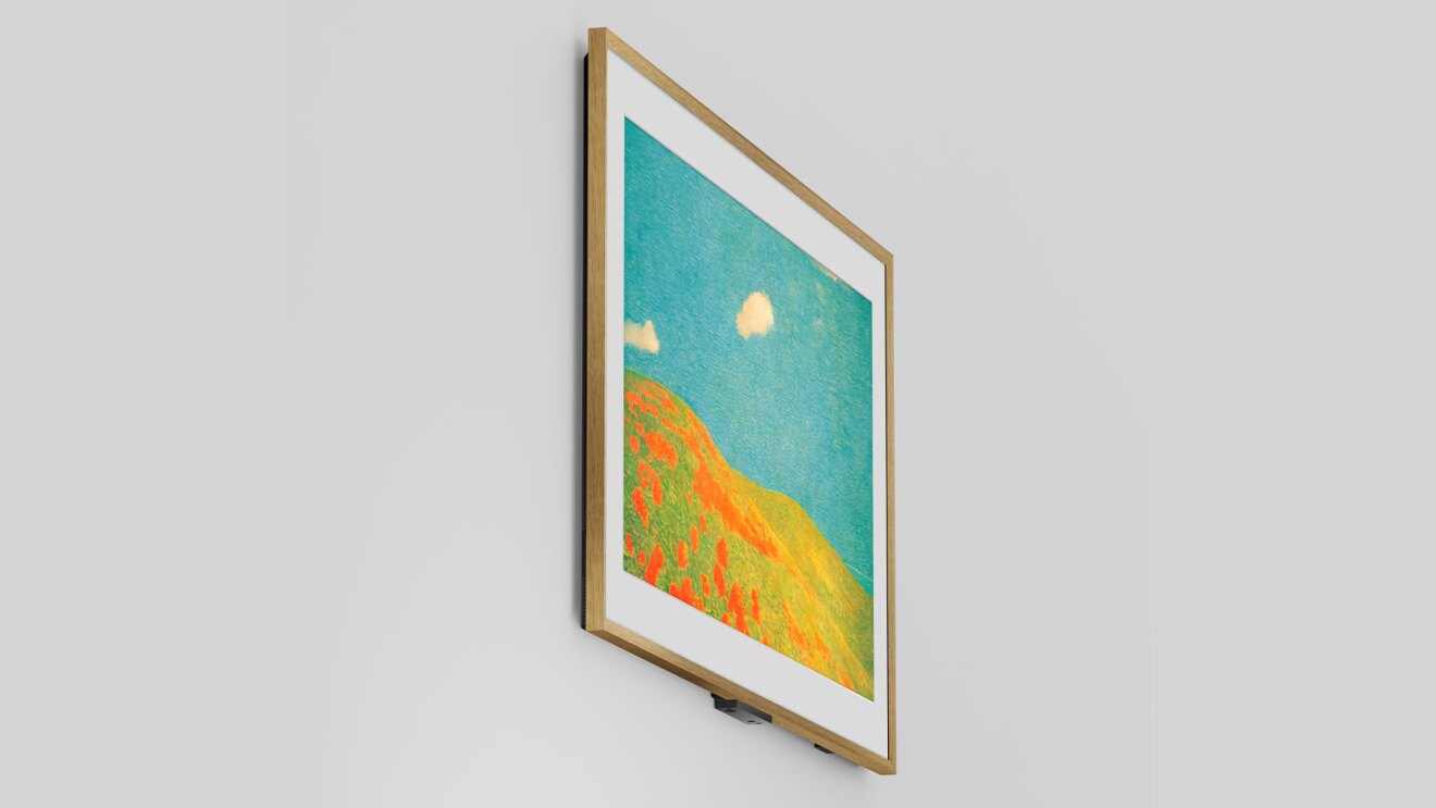 Framed colorful landscape painting with vibrant orange hillside and turquoise sky