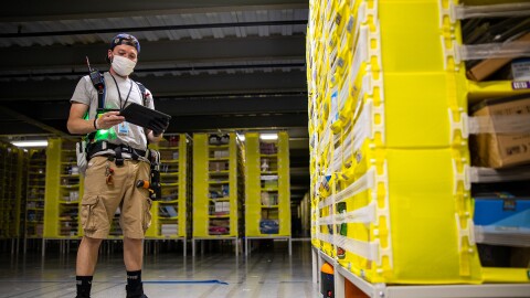 Amazon associate wears a mask while working. Photo taken during COVID-19 pandemic.