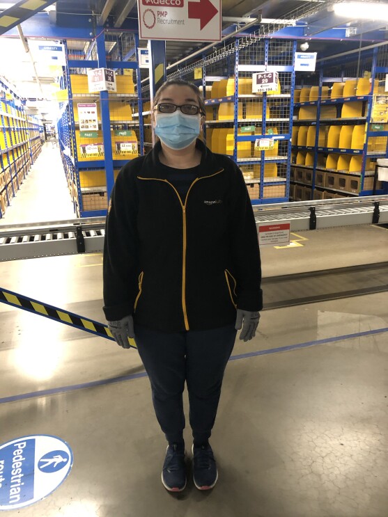 Employee wearing mask at Amazon fulfilment centre