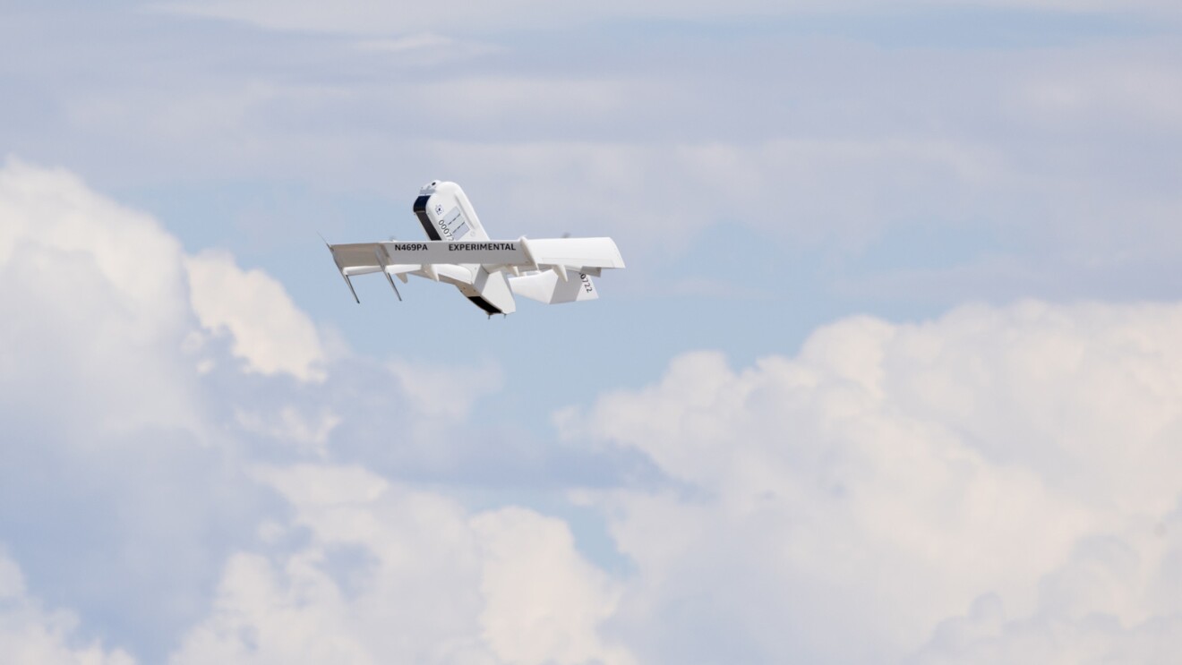 Images of an Amazon employee wearing an orange safety vest next to an Amazon drone. Images of a drone in air.