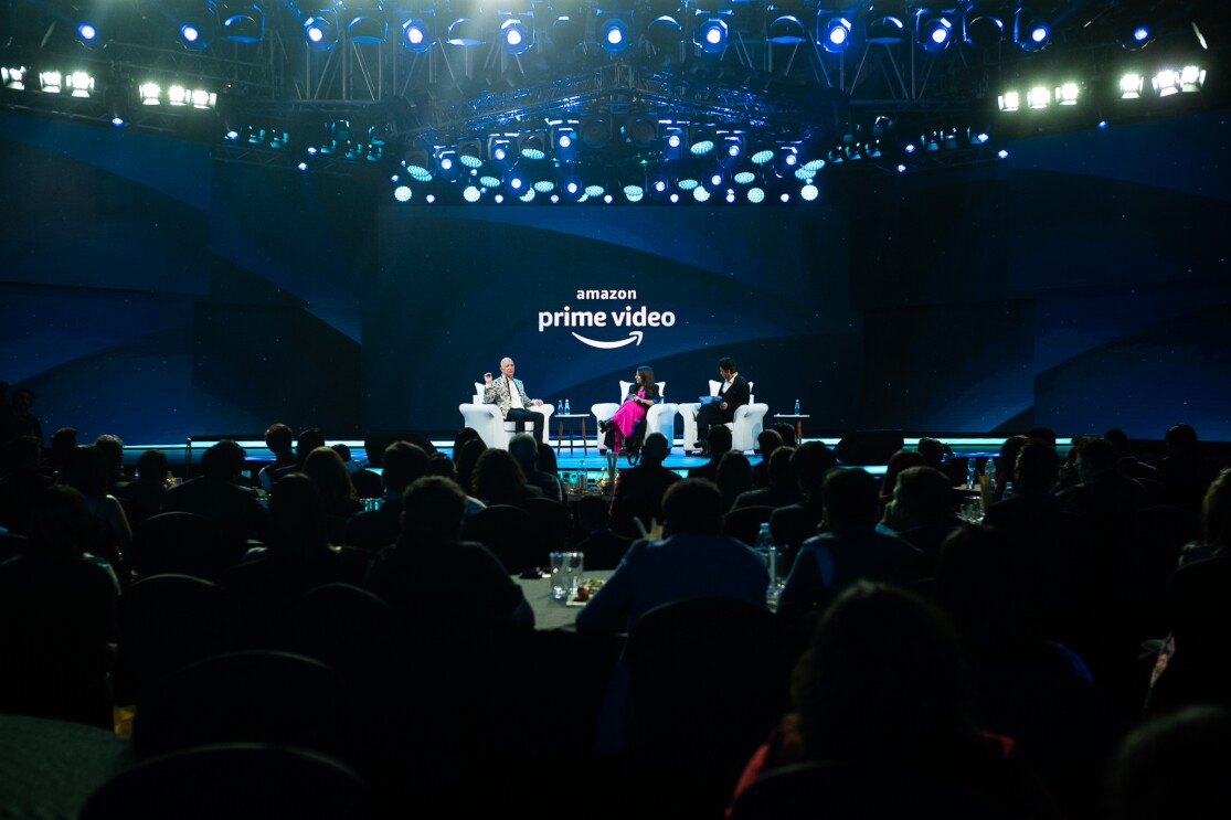 Jeff Bezos sits on stage with Bollywood star Shah Rukh Khan and director Zoya Akhtar during Prime Video in India update and announcement.