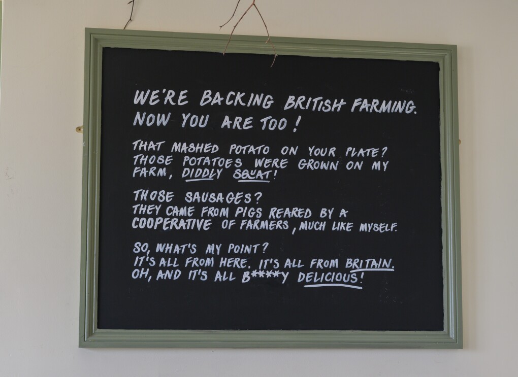 A sign at The Farmer's Dog in Burford, Jeremy Clarkson's proper British pub from Clarkson's Farm season 4, which states its mission to back British farming