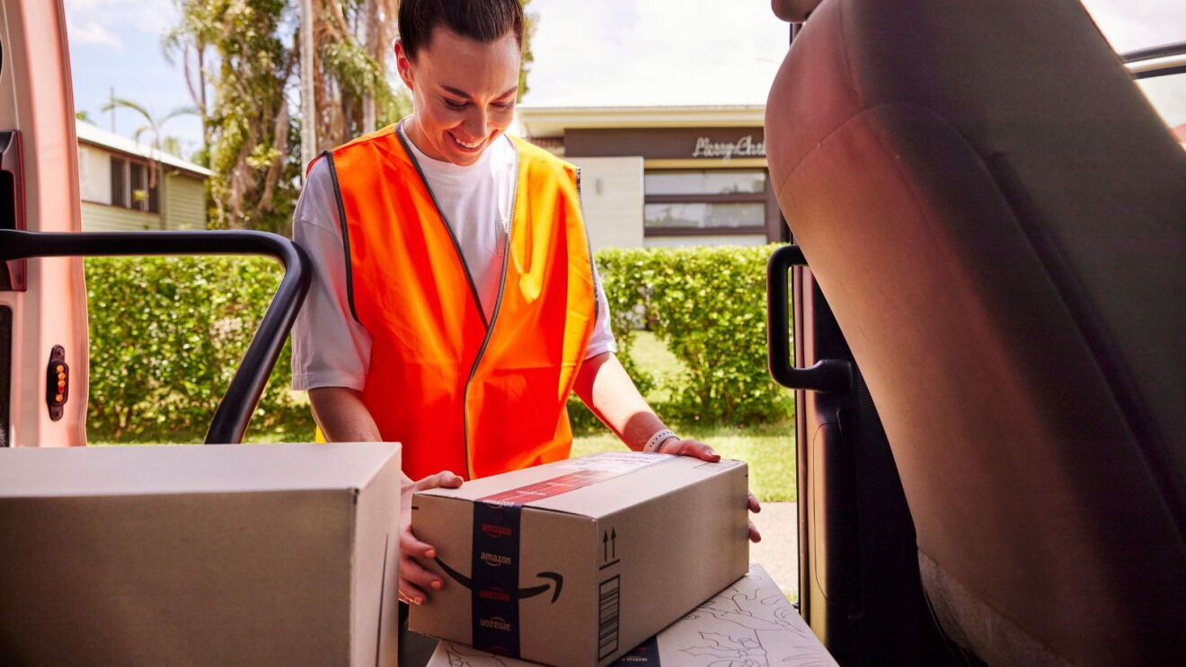Mackenzie Arnold unloading Amazon packages from a van.