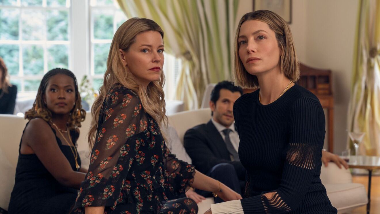Tense scene from a drama series set in a luxurious room.