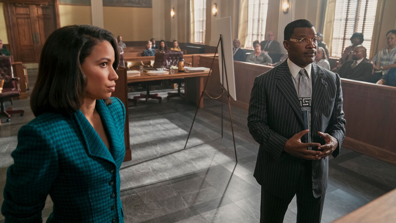 Jurnee Smollett and Jamie Foxx presenting in a courtroom in the movie, The Burial.