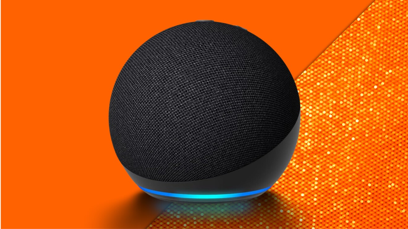 Spherical black Echo Dot smart speaker with blue light ring on vibrant orange background