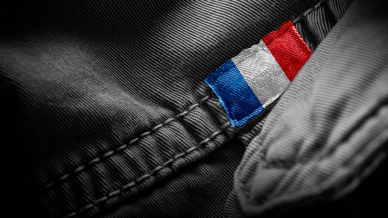 A close up image of a tag representing the French flag on an apparel item