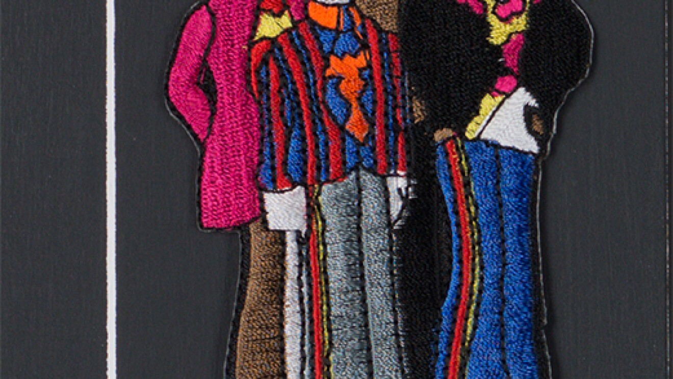 A sewn patch depicting the four members of the Beatles.