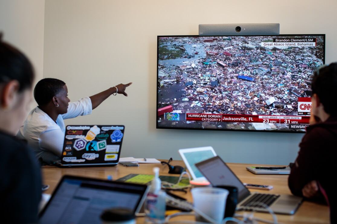 team viewing screen for disaster relief coordination