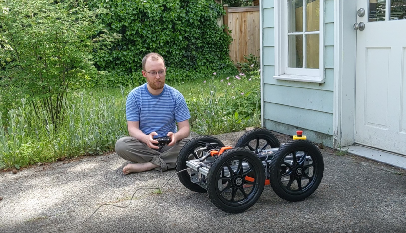 Amazon employee working on robotics advancement from his garage during the pandemic